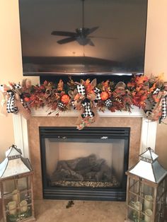 a living room with a fireplace decorated for fall