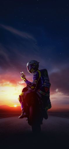 a man riding on the back of a motorcycle at sunset