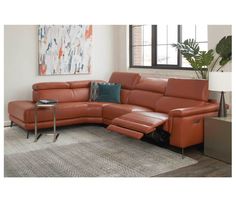 an orange leather sectional sofa in a living room