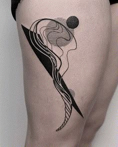 a woman's thigh with an abstract tattoo on it