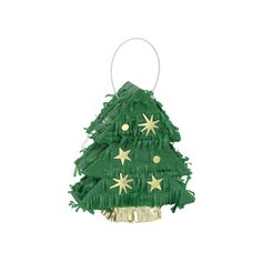 a green christmas tree decoration hanging from a white wall with gold stars on the top