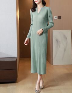 This versatile Pleated Long Sleeve Slim Fit Midi Dress can be dressed up or down to suit any situation. The lightweight fabric also lets you stay cool on a hot summer day. Elegant Green V-neck Long Sleeve Dress, Winter Stretch V-neck Dress, Casual V-neck Sweater Dress For Spring, Elegant Green V-neck Mini Dress, V-neck Sweater Dress For Spring, Casual Solid Long Sleeve V-neck Dress, Fitted V-neck Sweater Dress, Spring V-neck Stretch Sweater Dress, Chic Long Sleeve V-neck Dress In [color]