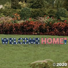 a welcome home yard sign in the grass