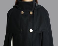 * A cool and long wool cape coat with hood, very elegant. * With double row gold color buttons and two pockets, fully lined. * If you want black buttons, please let us know, thanks. * Stand up collar, more warmer. * Material: out shell - 50% wool, 50% polyester; lining - 100% polyester * Care: dry cleanable * Shop sizing chart FYI ( made according to US sizing. actual body figures, not laying flat clothes measurements) Size XS (US 2, UK 6, German 32, French 34, ) Bust: fits bust around 33.5 inch Luxury Wool Cape For Winter, Luxury Wool Winter Cape, Hooded Wool Cape For Winter, High Neck Coat, Wool Cloak, Wool Cape Coat, Shawl Winter, Cloak Coat, Poncho Jacket