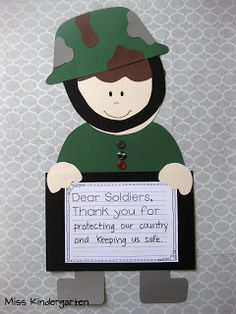 a soldier holding a sign that says dear soldiers thank you for protecting our country and keeping us safe