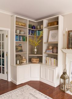 a living room filled with lots of white furniture