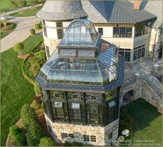 an aerial view of a large house with a glass roof