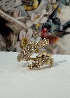 Adjustable Cherry Blossoms Ring - Gold Cherry Blossom, Adjustable Ring, Flower Ring, Spring Jewelry, Flowers, Bridal Party Jewelry, Gold Jewelry. Adjustable cherry blossoms ring. Beautiful for every day. Now in your choice of sterling silver or bronze gold. As with all adjustable rings we recommend adjusting this ring to the correct size and then leaving it alone. Excessive opening and closing can weaken the band and create cracks and possible breakage. **PLEASE NOTE: THIS LISTING IS ONLY FOR ON Cherry Blossom Ring, Bridal Party Jewelry, Spring Jewelry, One Ring, Flower Ring, Polish Jewelry, Gorgeous Necklaces, Adjustable Rings, Cherry Blossom