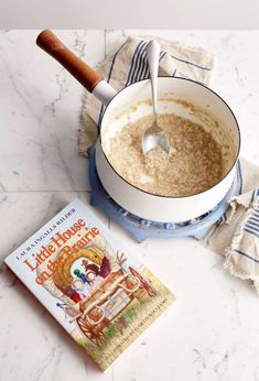 an oatmeal in a pan with a book on the side