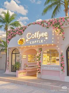 a coffee shop with pink flowers on the front and side walls, surrounded by palm trees