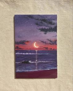 an image of a painting on paper with the moon in the sky above the ocean