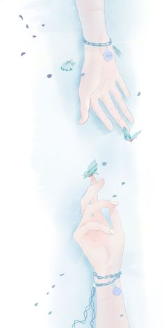 two hands reaching for each other in front of blue water with small fish floating around