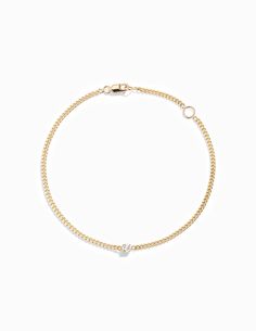 This solid 14k bracelet has a prong-set 3mm diamond on a flat curb chain with a lobster clasp closure. Measurements: Chain Width: 1.8mm Carat Weight: 0.10 Small - 6" with a loop at 5" Medium - 7" with a loop at 6" Large - 8" with a loop at 7" Classic Cuban Link Diamond Bracelet, White Gold Curb Chain Bracelet, Everyday Diamond Box Chain Jewelry, Everyday Round Curb Chain Bracelet, Everyday Curb Chain Bracelet, Yellow Gold Diamond Bracelet With Cuban Link Curb Chain, Elegant 14k Gold Diamond Bracelet With Curb Chain, Classic 14k Gold Diamond Bracelet With Chain, Classic Cuban Link Diamond Bracelet In Yellow Gold