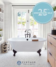 a white bath tub sitting next to a window