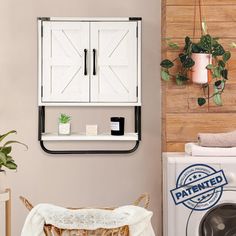 a washer and dryer sitting next to each other in a room