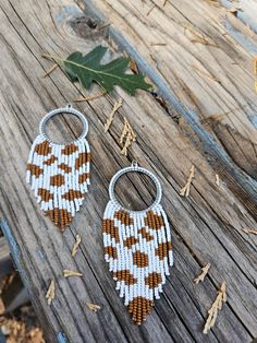 Terra Cotta & White Cow Print Earrings Original Sequoia Stone Cow Pattern  Light weight Ear wires are stainless steel but can be swapped out for Sterling silver, closed hooks for gaged ears, or other hooks as requested Cow Print Beaded Earrings, Gaged Ears, Indigenous Beading, Cow Print Earrings, Handwoven Earrings, White Cow Print, Fall Bead, Ombre Earrings, Gold Bead Earrings