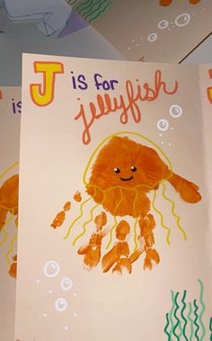 two children's books with hand prints on them, one is for jellyfish