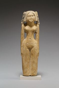 an ancient statue is shown on display