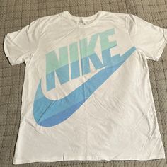 Nike T-Shirt Xxl White & Blue Athletic Cut 100% Cotton Nwot Never Worn Pit To Pit 24” Top To Bottom 30” Casual Light Blue T-shirt With Logo Print, Casual Light Blue T-shirt With Logo, Light Blue Logo Print Crew Neck T-shirt, Light Blue Crew Neck T-shirt With Logo, Light Blue Cotton T-shirt With Logo Print, Nike Light Blue Crew Neck T-shirt, Blue Nike T-shirt With Logo Print, Nike Blue T-shirt With Logo Print, Light Blue Casual Sports T-shirt