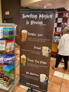 a sign that is in the middle of a store with some drinks on display behind it