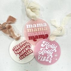 three badges with the words mama, mamma, and baby on them are shown