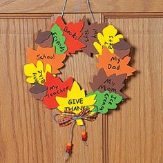 a wreath made out of leaves with words on it