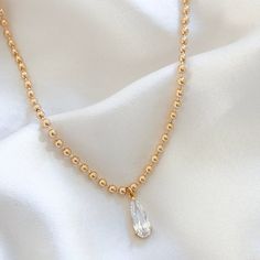 LE sensor necklace Hayes CZ Teardrop Necklace Dainty Teardrop Cubic Zirconia Drop Necklace, Dainty Cubic Zirconia Teardrop Necklace, Gold Teardrop Crystal Necklace With Delicate Chain, Gold Teardrop Drop Necklace, Gold Cubic Zirconia Drop Necklace, Gold Teardrop Pearl Chain Drop Necklace, Elegant 14k Gold-filled Teardrop Necklace, Delicate Gold Teardrop Crystal Necklace, Teardrop Necklace