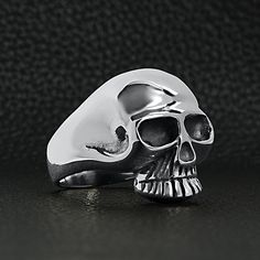 Description: This intricately designed sterling silver skull ring is guaranteed to turn heads! Handcrafted with precision, this statement piece is perfect for anyone who wants to add a touch of edge to their style. Whether you're pairing it with a casual outfit or dressing up for a night out, this ring is sure to make a statement. The perfect gift for yourself or someone special, this ring is sure to become a favorite in your jewelry collection. The Wholesale Sterling Silver Skull Ring is made o Sterling Silver Skull Rings, Silver Skull Ring, Biker Jewelry, Jewelry Website, Skull Ring, Wholesale Jewelry, On The Road, Casual Outfit, Personalized Jewelry