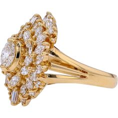 a yellow gold ring with diamonds on it