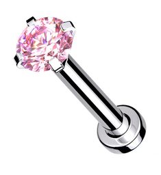 a piercing with a pink diamond on it