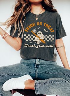 This cute Halloween dentist ghost shirt will be the perfect gift for that person who loves funny spooky tees! Our t-shirts are 100% made in the USA, and we use a high-quality unisex t-shirt that is insanely soft. In fact, it will be one of the softest, best fitting, most comfortable shirts you've ever owned.  ⭐ PREMIUM QUALITY ⭐ ▪️ 100% Cotton ▪️ Made in the USA 👕 SIZING 👕 All our shirts are unisex fit. We always recommend our customers to size up for a stylish oversized look. You can see our Spooky Short Sleeve Shirt With Letter Print, Dental Halloween Shirt, Halloween Relaxed Fit Graphic T-shirt, Halloween Graphic Print Relaxed Fit T-shirt, Dental Hygienist Gifts, Halloween Crew Neck Soft-washed T-shirt, Spooky T-shirt With Funny Print In Relaxed Fit, Halloween Soft-washed Relaxed Fit T-shirt, Spooky Relaxed Fit T-shirt With Funny Print