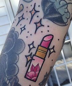 a person with a tattoo on their arm has a lipstick and stars in the background