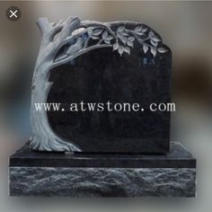 a black marble monument with a tree on it's base and the inscription atwonment com