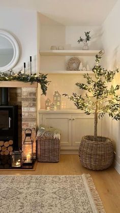 a living room filled with furniture and a fire place next to a tree in a basket