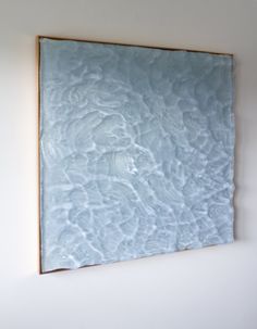 an abstract painting hanging on the wall