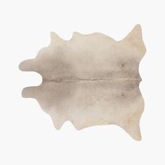 a leaf shaped object on top of a white surface with water reflection in the middle