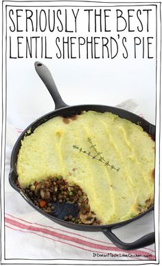 a pan filled with shepherd's pie on top of a red and white towel