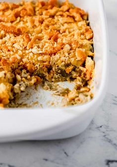 a casserole dish filled with food on top of a table