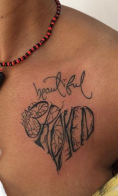 a woman with a tattoo on her chest