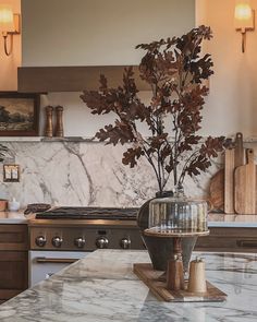 a kitchen with marble counter tops and an oven