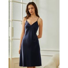 This dress is perfect as a nightdress, providing ultimate comfort for a peaceful night's sleep. Additionally, it can be worn as a discreet extra layer under clothing, adding an extra touch of coverage and comfort. Elegant V-neck Sleepwear For Lounging, Elegant Loungewear Dress In Solid Color, Elegant Summer Dresses For Relaxation, Elegant V-neck Sleepwear For Relaxation, Elegant Blue Sleepwear For Relaxation, Elegant Sleeveless Sleepwear, Elegant Solid Color Sleepwear, Elegant Sleeveless Slip Dress For Bedtime, Elegant Sleeveless Nightgown For Home