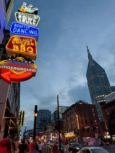 the neon signs are lit up for everyone to see