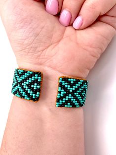 Made using genuine Guatemalan leather and exquisite glass beads, this cuff bracelet gives off an elegant and luxurious feel. Its unique patterns are brilliantly colored with strong Native American influences. Every piece in our collection is hand stitched with impeccable precision and detail. They are designed to make you feel bold and empowered! Flexible cuff fits all-sized adult wrists Band width measures approximately Handmade in Guatemala *Please note that all of our items are handcrafted an Bohemian Beaded Cuff Bracelets As Gift, Adjustable Cuff Beaded Bracelets As Gift, Unique Beaded Leather Bracelet As Gift, Beaded Cuff Bracelet Gift, Beaded Cuff Bracelets As Gift, Beaded Cuff Bracelets For Gift, Beaded Cuff Bracelet As Gift, Turquoise Cuff Bracelet With Round Beads As Gift, Unique Cuff Beaded Bracelets For Gifts