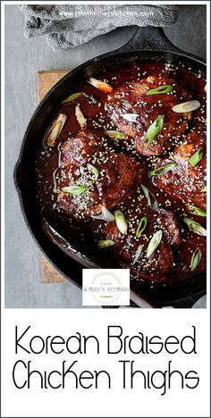 korean braised chicken thighs in a cast iron skillet with sesame seeds and green onions