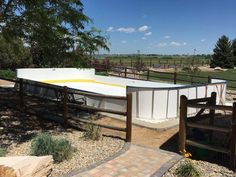 an ice rink in the middle of a field