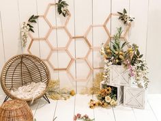 the room is decorated with honeycombs, flowers and wicker baskets for decor