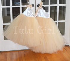 "Classic and beautiful, our one strap style tutu dress is made in a mix of ivory and our champagne/beige skirt. The top of the dress is FULLY LINED and the top of the strap opens to tie with a matching ribbon strap which ties at the right shoulder. The back of the dress is stretchy elastic along the top hem. We can make this dress in literally any color skirt (or even a mixture of colors). Convo us for questions. WANT A SEWN IN SLIP TO LINE THE TUTU? https://www.etsy.com/listing/125566641/add-a- Spring Cream Tutu Dress In Tulle, Spring Cream Tulle Tutu Dress, Spring Cream Tutu Dress Made Of Tulle, Cream Tulle Tutu Dress For Bridesmaids, Cream Tulle Tutu Bridesmaid Dress, Cream Tulle Bridesmaid Tutu Dress, Elegant Cream Tutu Dress For Dress-up, Elegant Cream Tutu Dress For Summer, Elegant Cream Summer Tutu Dress