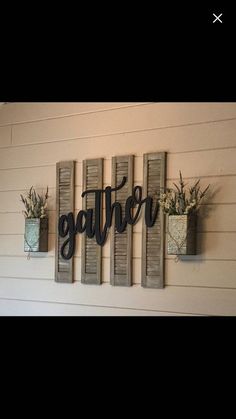 three wooden wall hangings with flowers in them and the words gather above them,