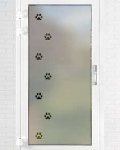 a glass door with dog paw prints on it