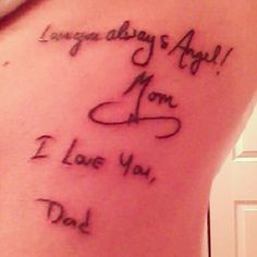 the back of a woman's stomach with an inscription on it that says, i love you dad